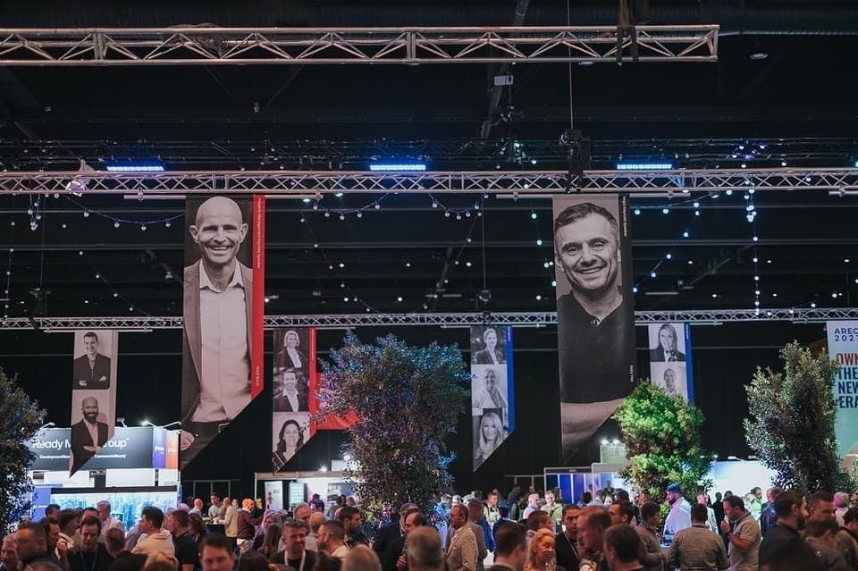 The AREC 2021 exhibition floor, packed hall with large speaker banners